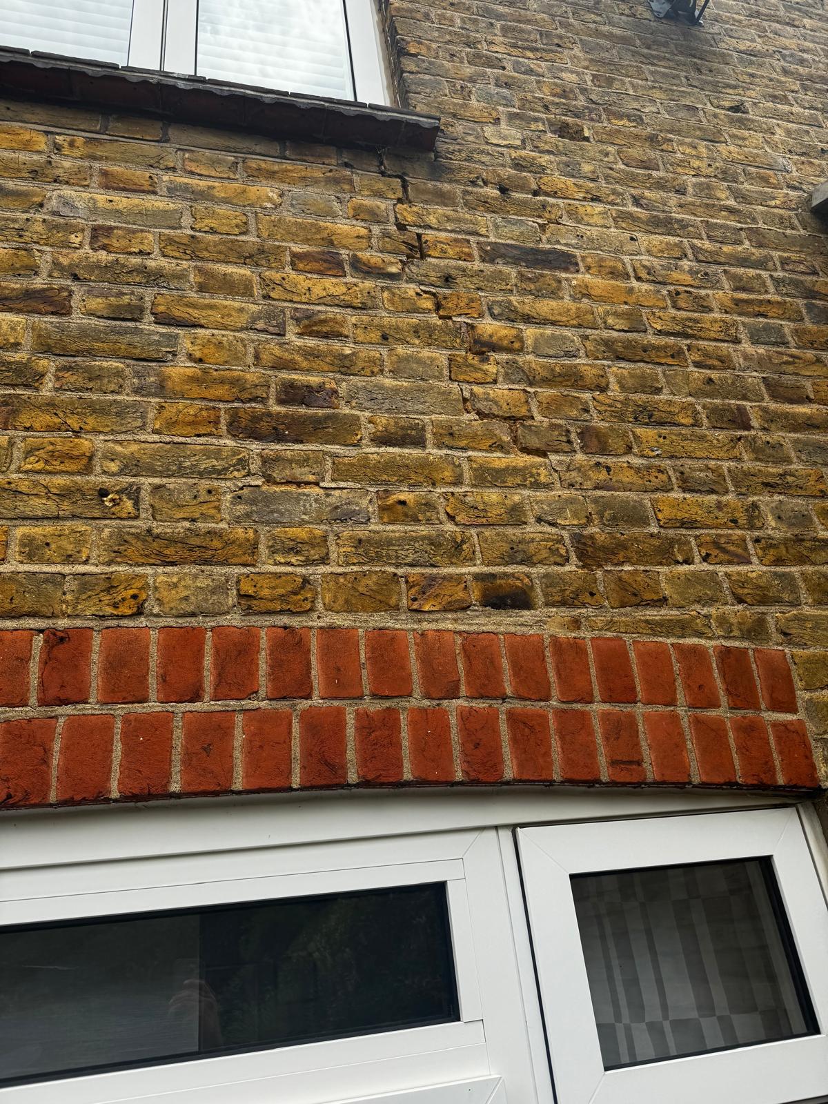 Damaged brickwork before repairs by Nelhams and Sons